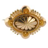 A late 19th century gold memorial brooch. The oval-shape scalloped panel, within a quatrefoil