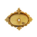 A late 19th century 15ct gold split pearl brooch. The split pearl, star set to the oval-shape panel,