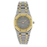 AUDEMARS PIGUET - a lady's Royal Oak bracelet watch. Stainless steel case with yellow metal bezel.