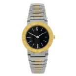BULGARI - a lady's Bulgari bracelet watch. Stainless steel case with yellow metal bezel. Reference