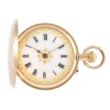 A full hunter pocket watch. Yellow metal case with engraved case front, stamped 14K with poincon.