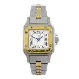 CARTIER - a Santos bracelet watch. Stainless steel case with yellow metal bezel. Numbered 090269269.