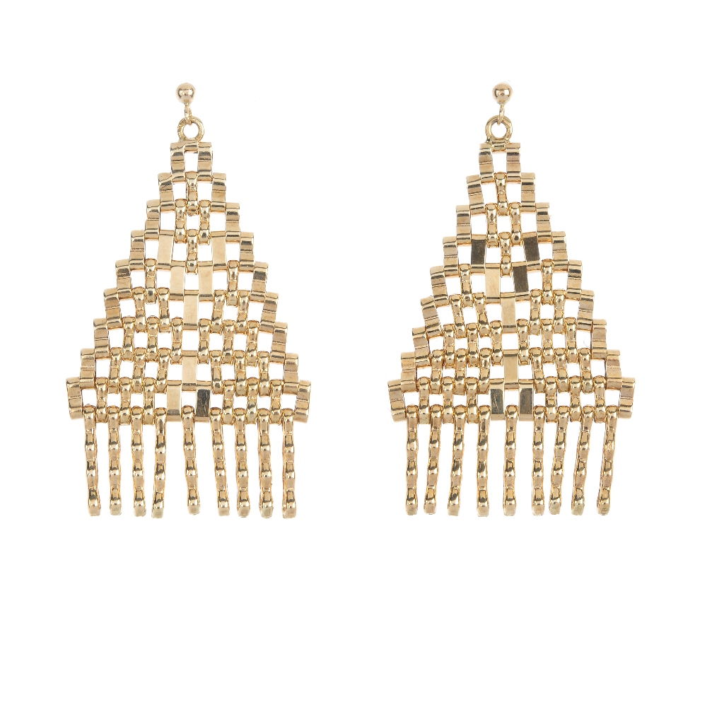 A pair of ear pendants. Each designed as an articulated triangular-shape panel with fringe detail.