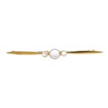 A late Victorian 22ct gold moonstone bar brooch, circa 1900. The graduated circular moonstone