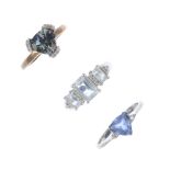 A selection of three diamond and gem-set dress rings. To include an aquamarine three-stone ring, a