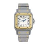 CARTIER - a Santos bracelet watch. Stainless steel case with yellow metal bezel. Reference 1566,