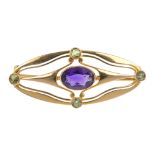 MURRLE BENNETT & CO. - a 15ct gold amethyst and demantoid garnet brooch. Of openwork design, the