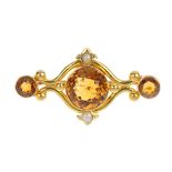 A late Victorian 15ct gold citrine and split pearl brooch, circa 1880. The graduated circular-