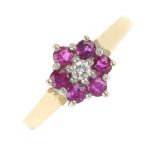 An 18ct gold ruby and diamond cluster ring. The brilliant-cut diamond, within a circular-shape