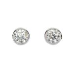 A pair of brilliant-cut diamond single-stone ear studs. Estimated total diamond weight 0.40ct, J-K