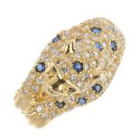 An 18ct gold diamond and sapphire leopard ring. The pave-set diamond leopard, with circular-shape