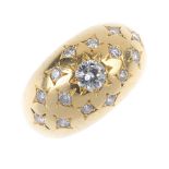A diamond dress ring. Of bombe design, the brilliant-cut diamond, within a star setting, to