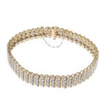 A 9ct gold diamond bracelet. Designed as a series of brilliant-cut diamond lines, with curved bar