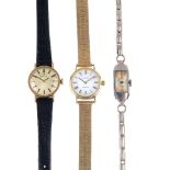 Three lady's wristwatches. To include a 9ct gold Tissot manual wind wristwatch with bark effect