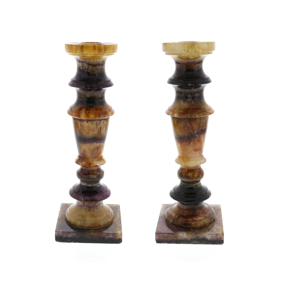 A pair of Blue John candlesticks. Assorted veins including Winnats One Each with moulded flat-rimmed