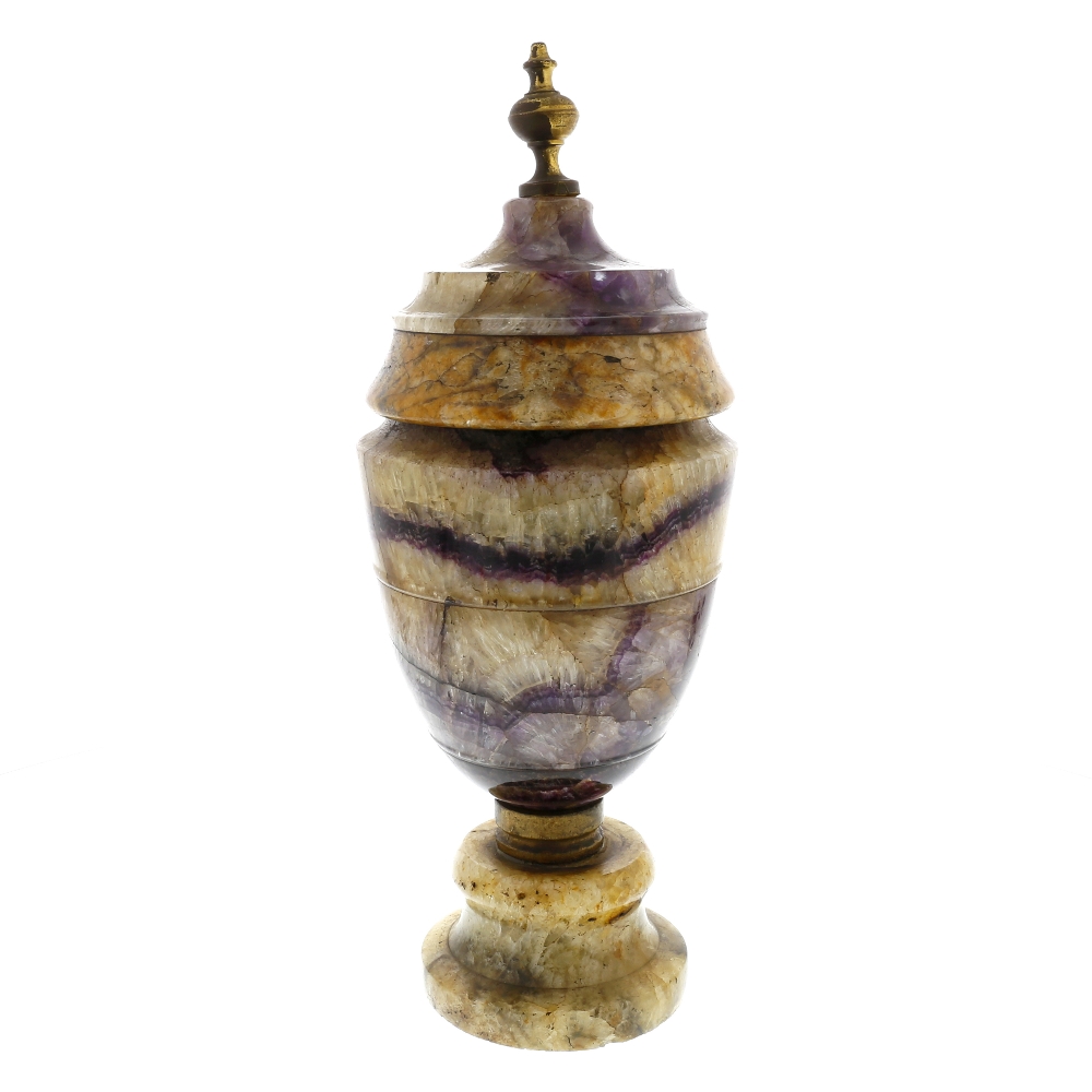 A large Derbyshire fluorspar urn Of neoclassical ovoid form with turned brass finial over fixed '