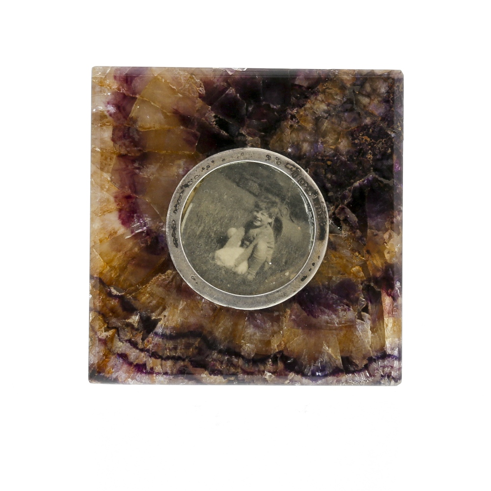 A Blue John photograph frame. Old Dining Room Vein Of square form with circular silver border