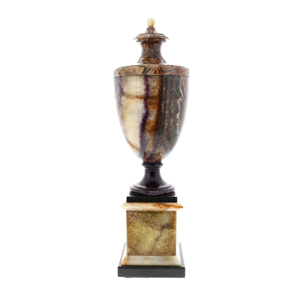 A large and fine Blue John pedestal urn Of neoclassical shouldered ovoid form with ball finial and