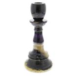 A Blue John candlestick. Winnats Five Vein With ovoid socket of dark hue on a one-piece pedestal '