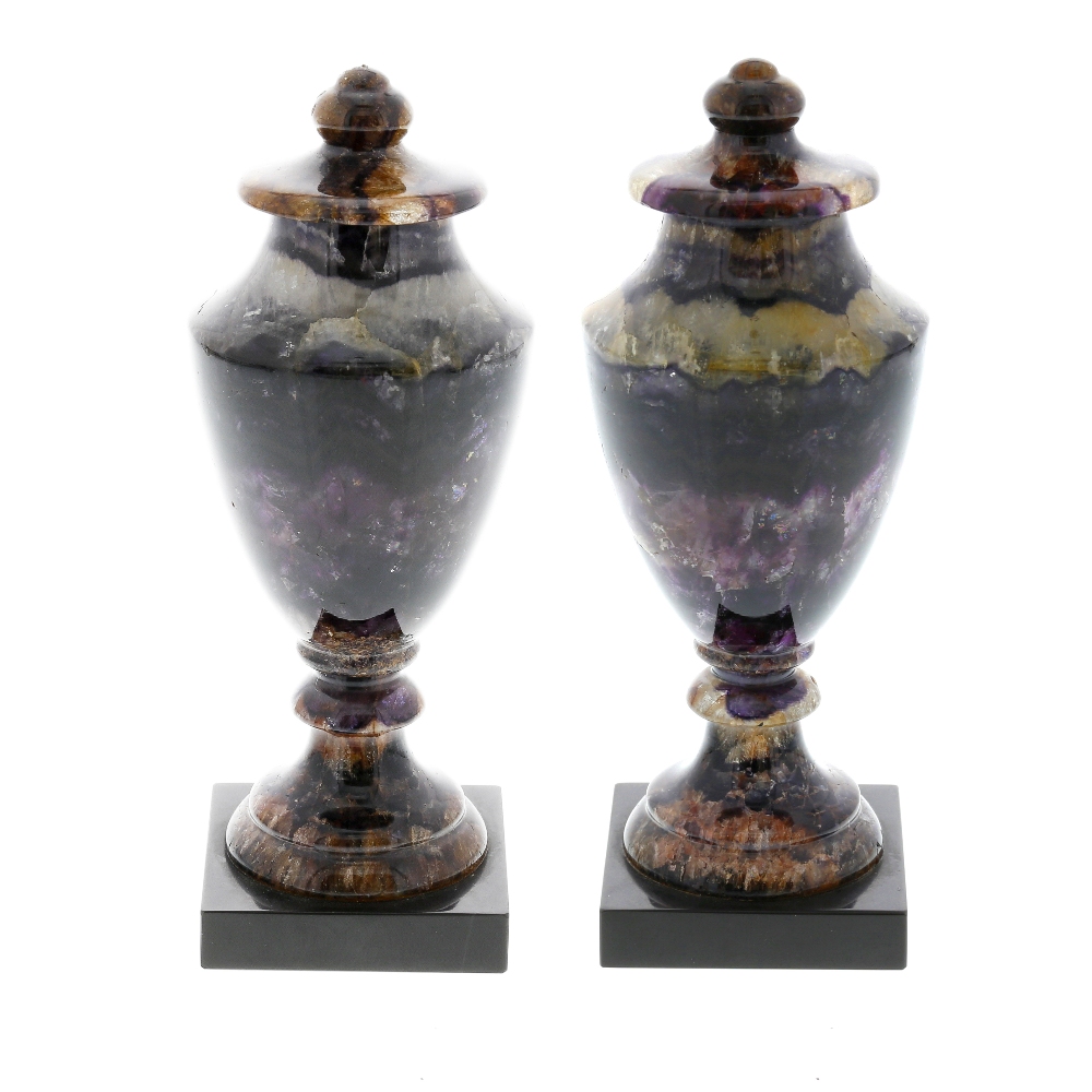 A pair of Blue John urns. Winnats Five Vein Each of neoclassical shouldered ovoid form, the domed