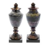 A pair of Blue John urns. Winnats Five Vein Each of neoclassical shouldered ovoid form, the domed