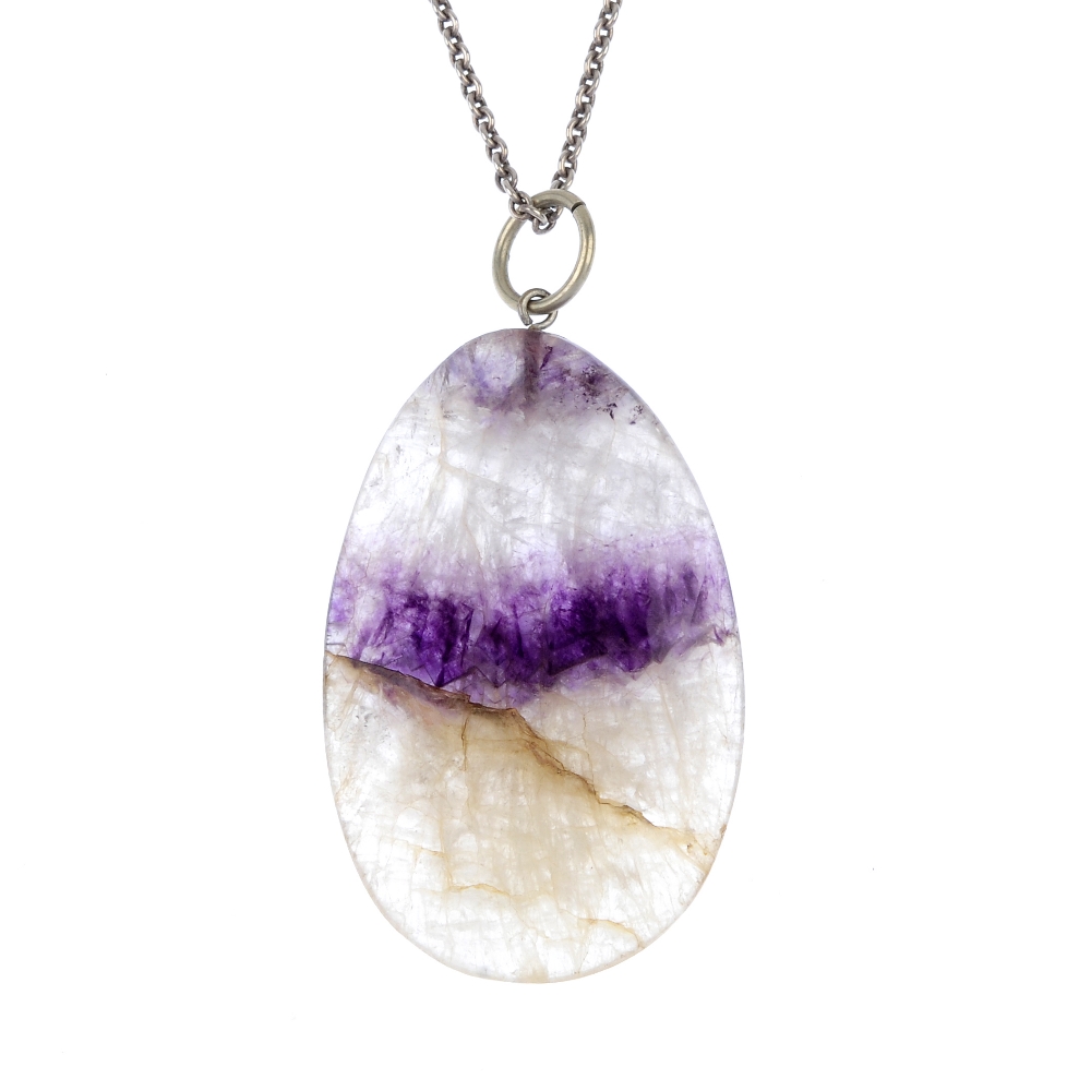 A Blue John pendant Of oval section with medial purple vein, 35mm x 56mm, with suspension loop and