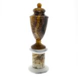 A Blue John pedestal urn. Millers Vein The shouldered ovoid body with ball finial to the domed fixed