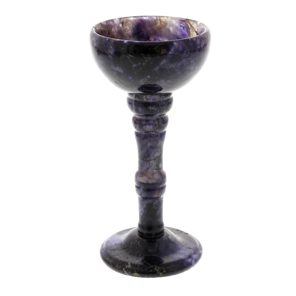 A Blue John pedestal cup The hemispherical bowl shading from dark violet to pale lilac with some