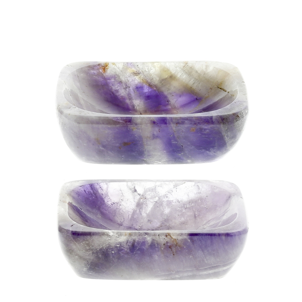 A pair of amethyst salts Each of dished oblong form with sloping sides, 62mm x 47mm x 18mm high,