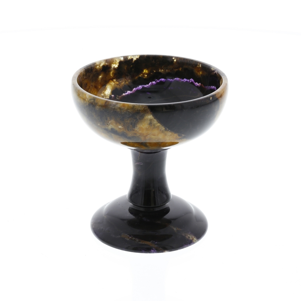 A Blue John pedestal cup The hemispherical bowl on a waisted stem and stepped domed foot, 68mm rim