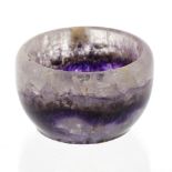 A small Blue John bowl. The hemispherical body with a medial band of violet veining beneath pale