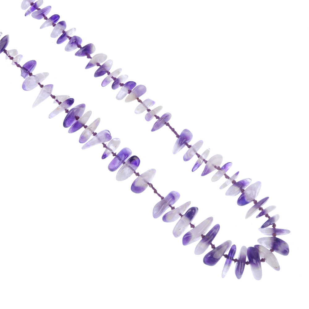 A group of assorted costume jewellery To include: an amethyst chip necklace, flowerhead ring,