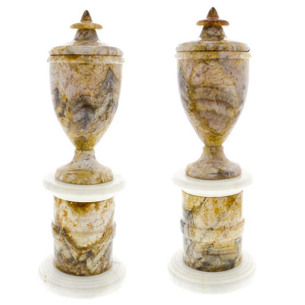 A pair of Derbyshire fluorspar pedestal urns Each of neoclassical shouldered ovoid form with