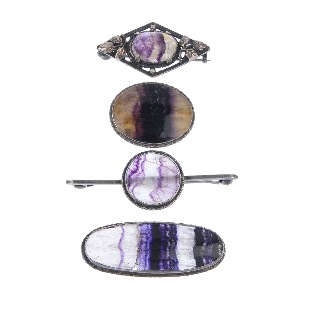 Four assorted Blue John brooches Comprising three oval, to include one cabochon within lozenge