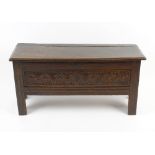 An antique oak rapier chest or blanket box, the hinged rectangular top with moulded edge above a