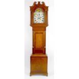 An early 19th century 8-day painted dial longcase clock with moon phase. Circa 1820, the 13-inch