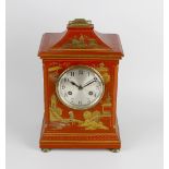 An early 20th century red lacquer chinoiserie mantel clock. Jahresuhrenfabrik, Triberg, Germany With