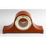 A modern Hermle 'Napoleon's hat' chiming mantel clock. The cream chapter ring having Arabic