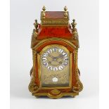 A good 19th century French red tortoiseshell mantel clock The break-arched brass dial with enamel