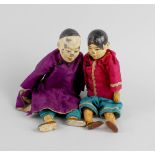 Two Chinese composition dolls, modelled as a male and female, each having painted papier mache head,