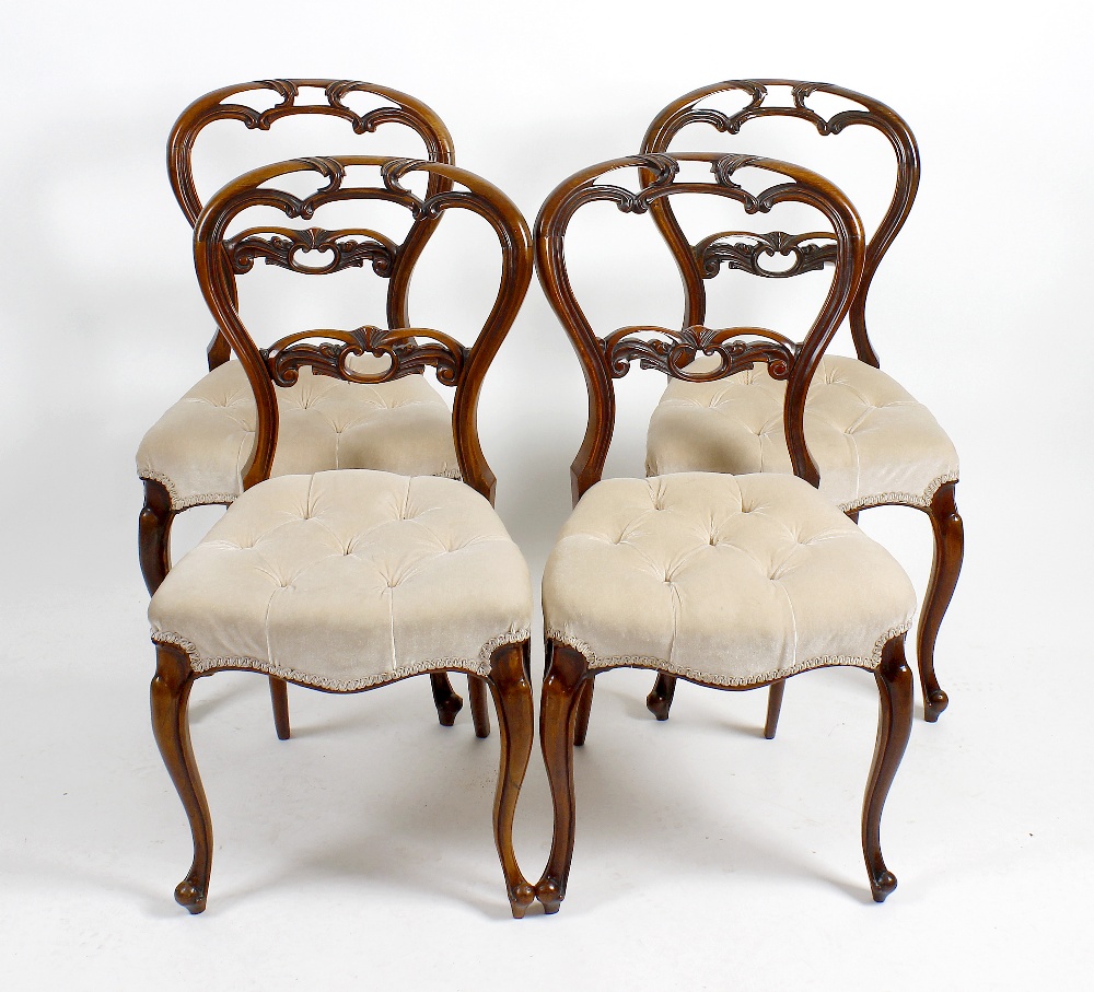 A set of four late 19th century rosewood and mahogany framed balloon backed dinning chairs. The open