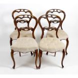 A set of four late 19th century rosewood and mahogany framed balloon backed dinning chairs. The open