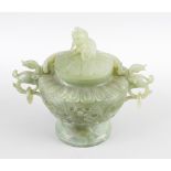 A Chinese carved green hard stone bowl and cover, the body carved with dual dragon and pearl