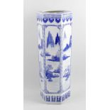 A Chinese blue and white porcelain stick stand. Of hexagonal form decorated to each side with panels