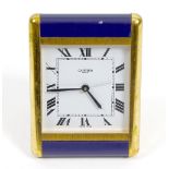 A Cartier desk clock The square white Roam dial marked CARTIER PARIS, within brass and dark blue