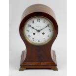 An early 20th century mahogany balloon-form mantel clock. The 5-inch white Arabic convex dial