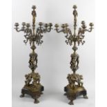 A pair of large Regency-style bronze candelabra. Each having six scrolling branches leading to the