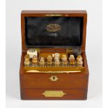 A 19th century mahogany-cased apothecary box The hinged rectangular cover with brass cartouche and