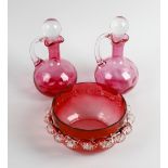 A set of eight glasses, each having cranberry glass bowls with clear glass stems and spreading