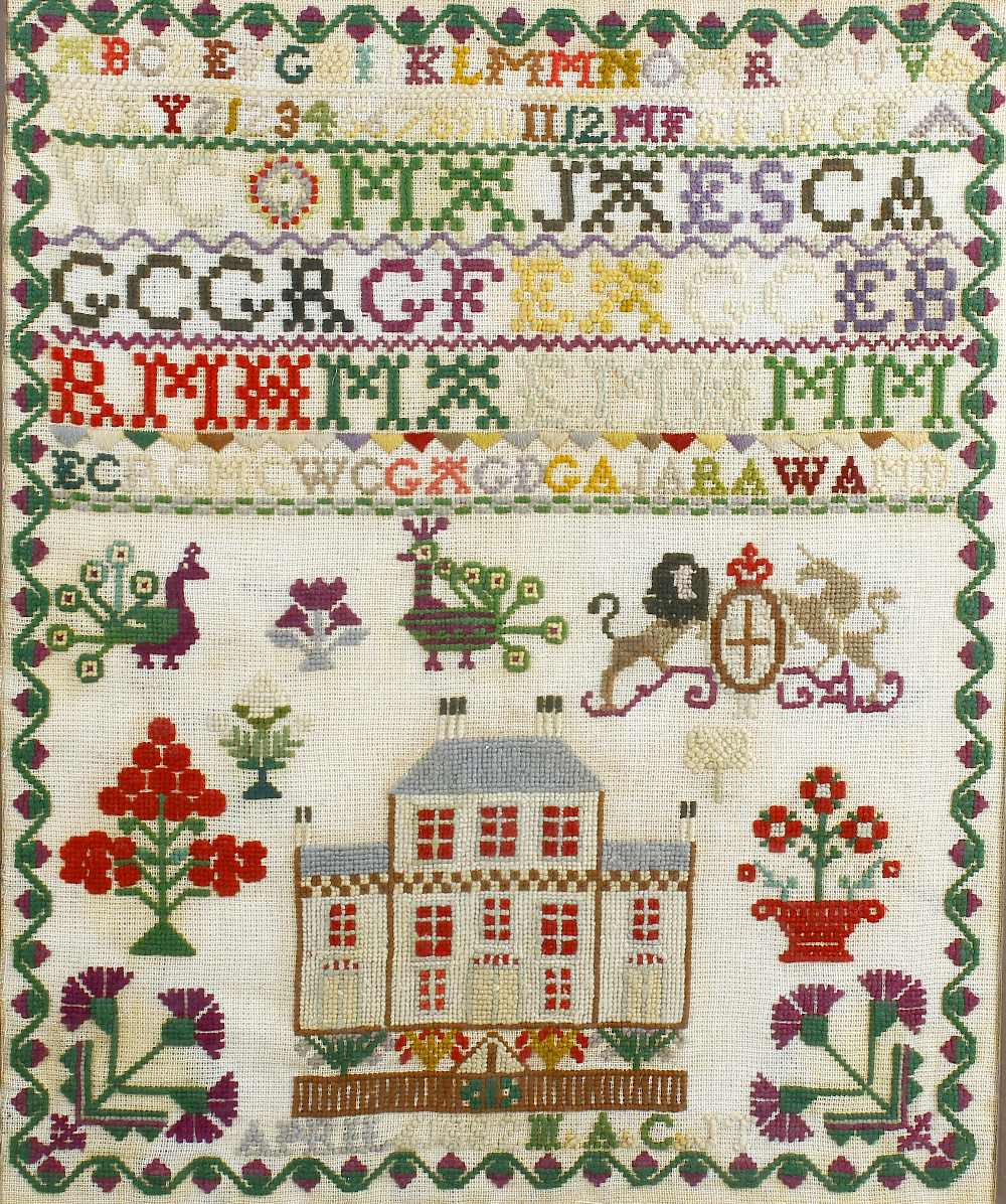 Two Victorian needlework samplers. Each of similar design, the first framed within wooden fire